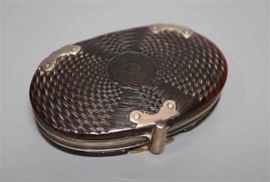 A 19th century white metal mounted tortoiseshell magnifying glass, 74mm.